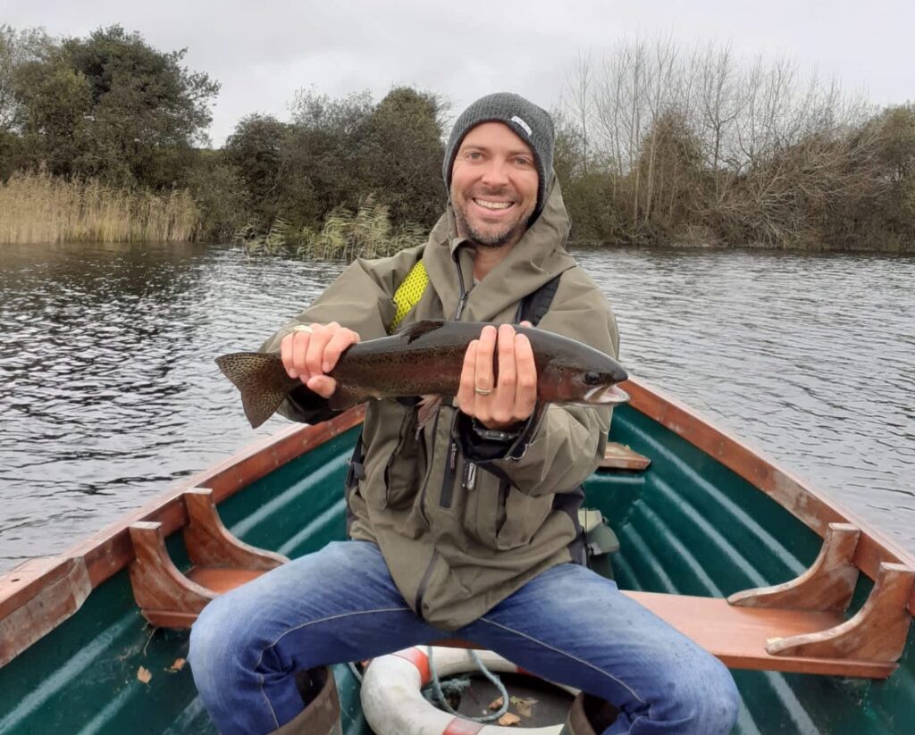 Alex Joyce guiding a fly fishing boat on the River Fergus, Ireland