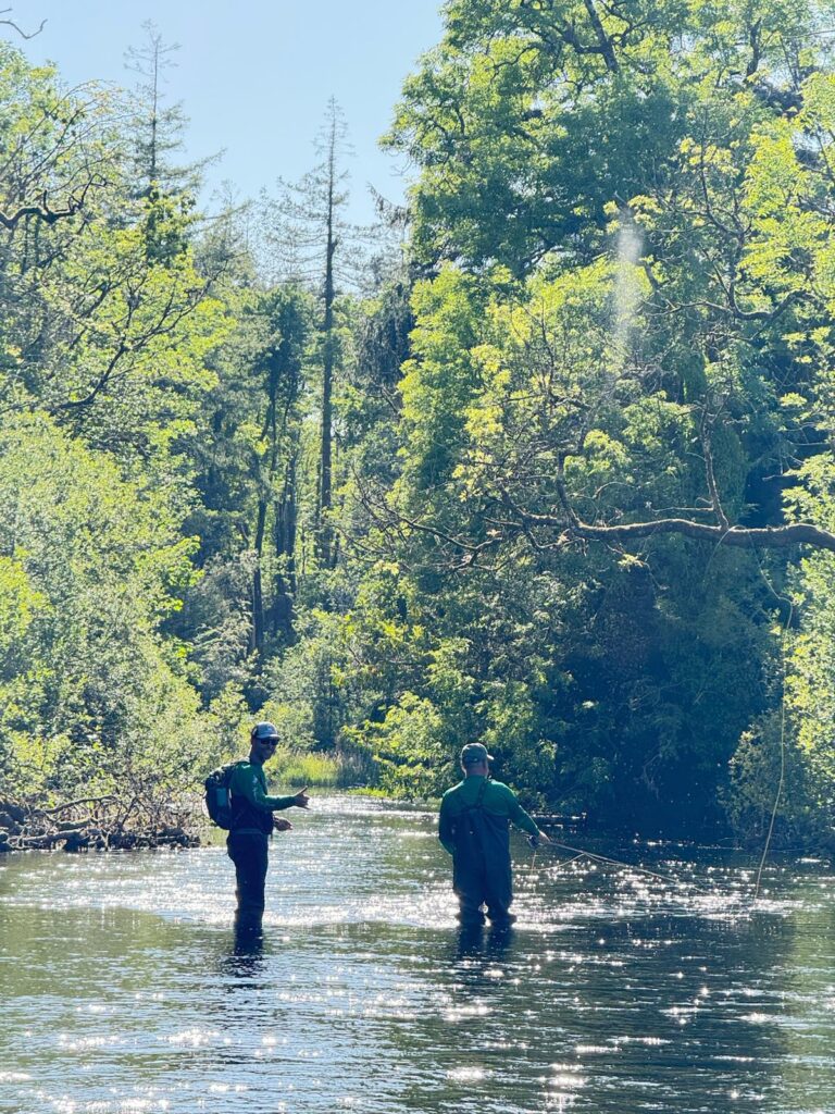Alex Joyce, local guide, fly fishing with a client on a Clare River in the Burren